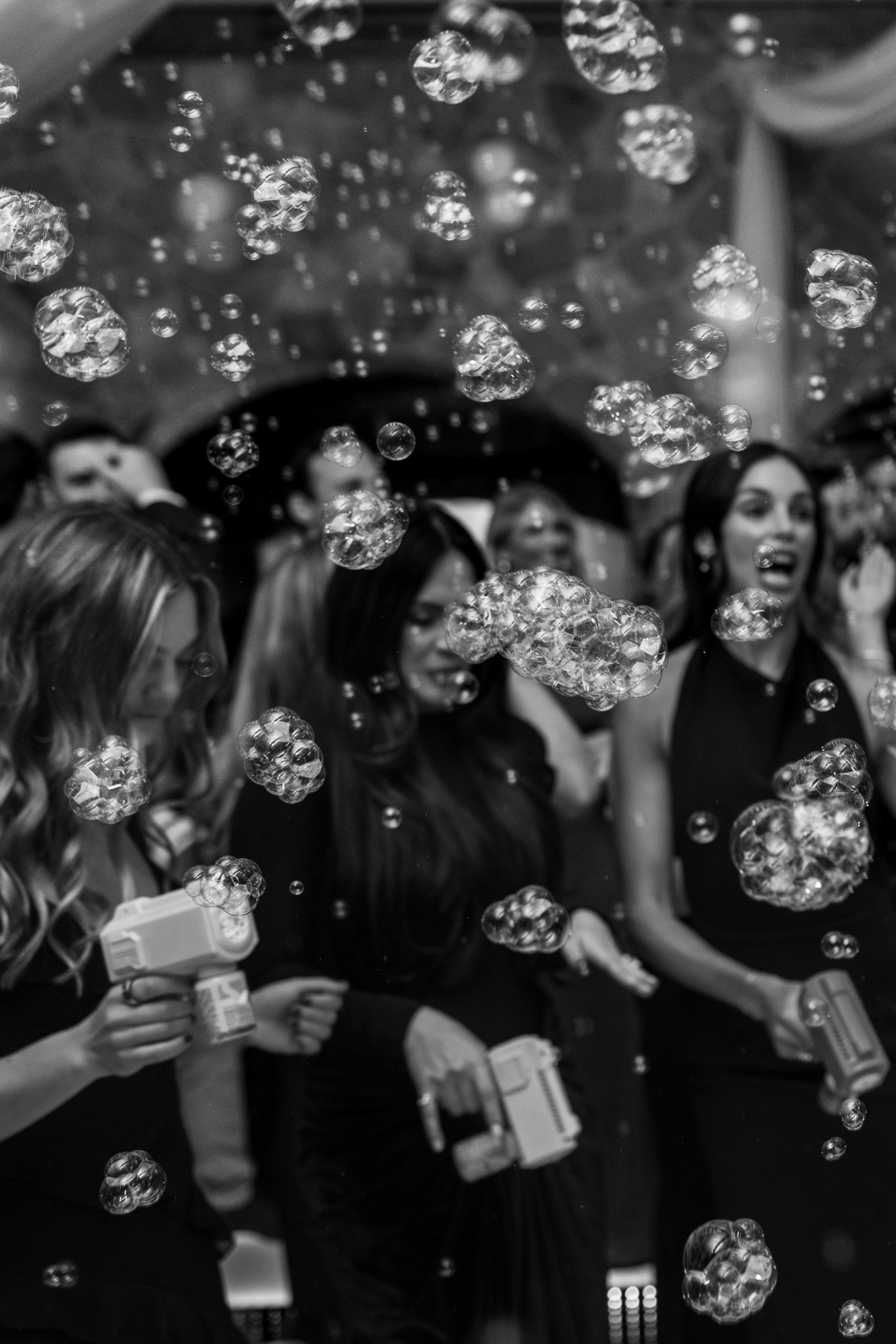 Black and white shot of bubble guns at the reception entrance